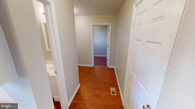 hall with dark hardwood / wood-style floors