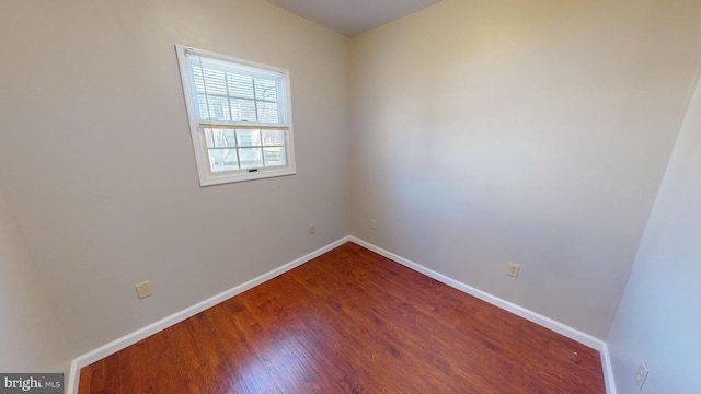 spare room with hardwood / wood-style floors