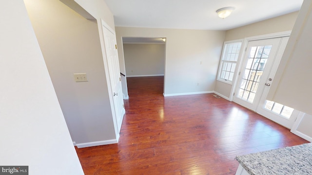 spare room with dark wood-type flooring