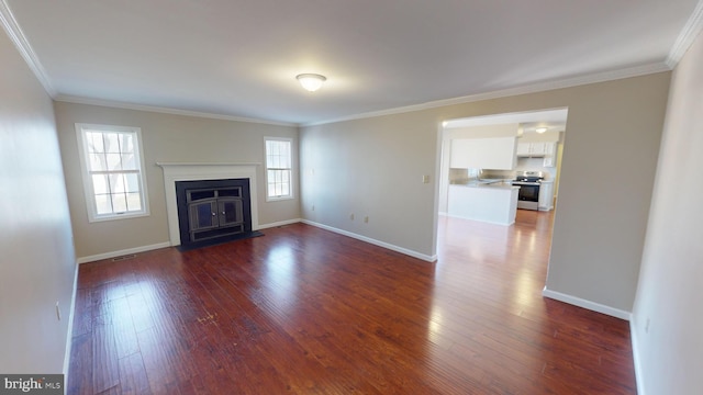 unfurnished living room with dark hardwood / wood-style floors and ornamental molding