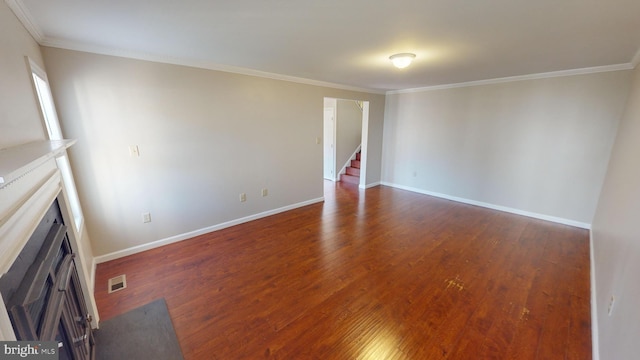 interior space featuring dark hardwood / wood-style flooring and ornamental molding