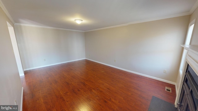 interior space featuring dark hardwood / wood-style flooring and crown molding