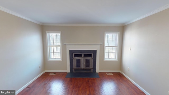 unfurnished living room featuring dark hardwood / wood-style flooring and ornamental molding