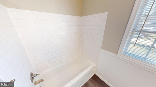 bathroom featuring hardwood / wood-style flooring and a healthy amount of sunlight