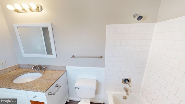 full bathroom featuring vanity, shower / bath combination, and toilet