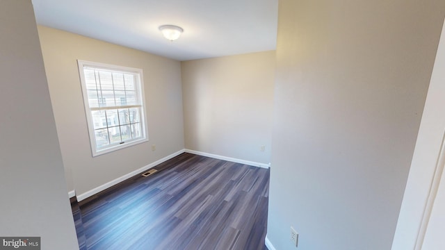 empty room featuring dark hardwood / wood-style floors