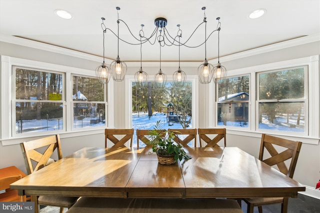 dining room featuring an inviting chandelier and ornamental molding