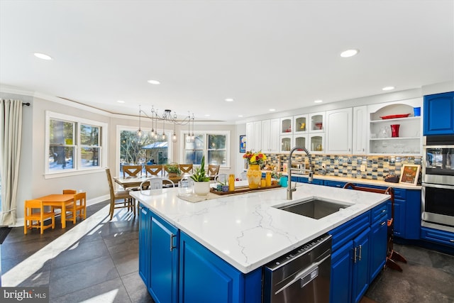 kitchen with white cabinetry, sink, stainless steel appliances, and blue cabinets