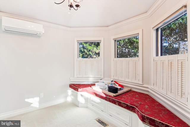 sitting room with a wall unit AC, carpet floors, ornamental molding, and a notable chandelier