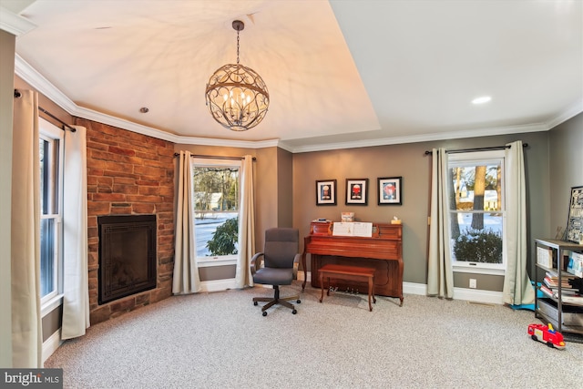 office space with a chandelier, carpet floors, a stone fireplace, and plenty of natural light