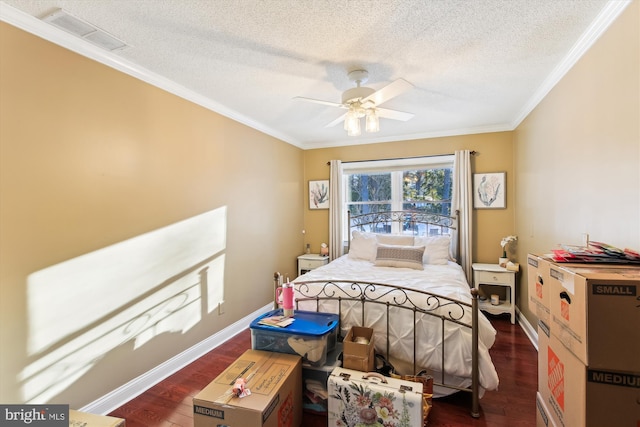 bedroom with ceiling fan, dark hardwood / wood-style flooring, crown molding, and a textured ceiling