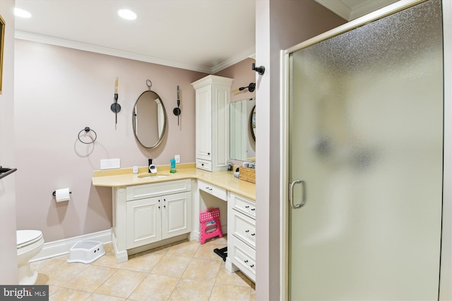 bathroom with vanity, tile patterned floors, a shower with door, and ornamental molding