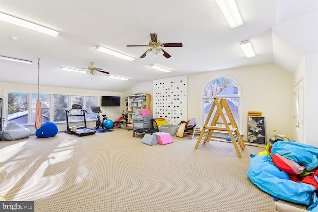 game room with ceiling fan and lofted ceiling