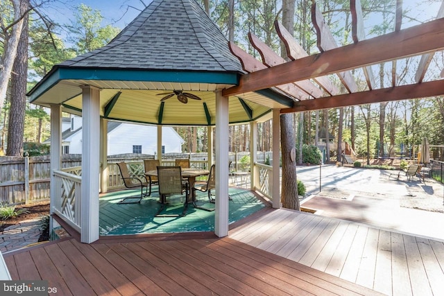 wooden terrace with a gazebo, a pergola, and ceiling fan