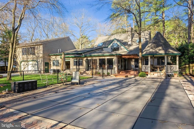 rear view of house with a yard