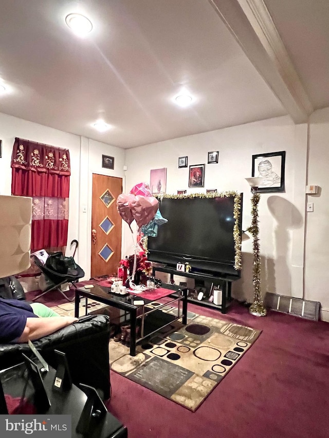 interior space featuring beamed ceiling and carpet floors