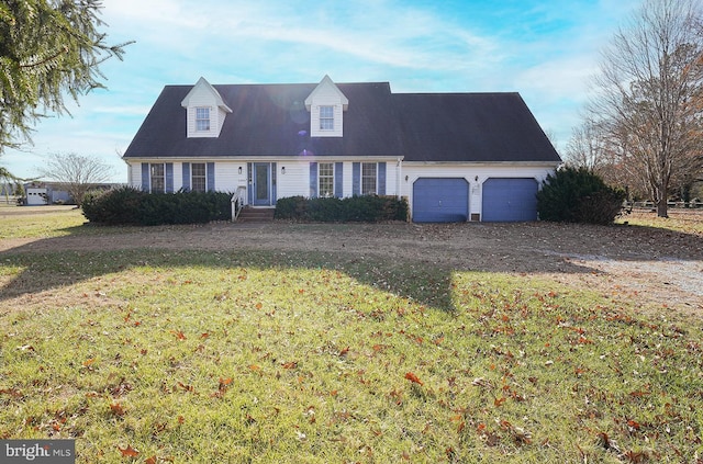 new england style home with a front yard and a garage