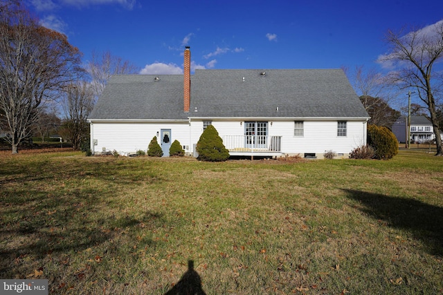 back of house featuring a yard and a wooden deck