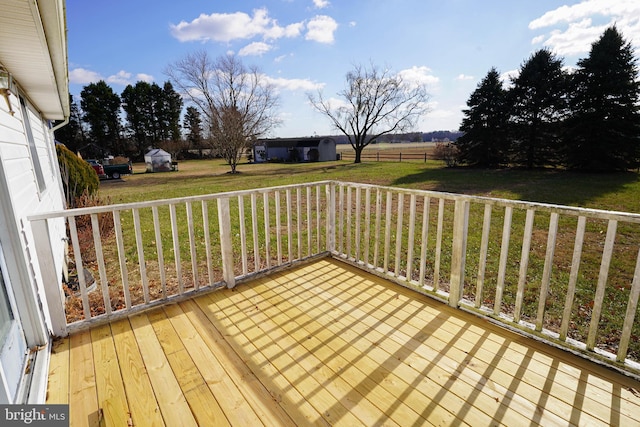 wooden deck with a lawn