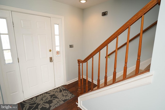 foyer entrance with dark hardwood / wood-style flooring