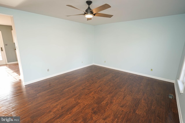 spare room featuring hardwood / wood-style floors and ceiling fan