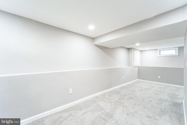 basement with light colored carpet