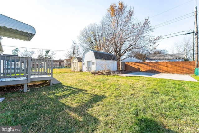 view of yard with a storage unit and a wooden deck