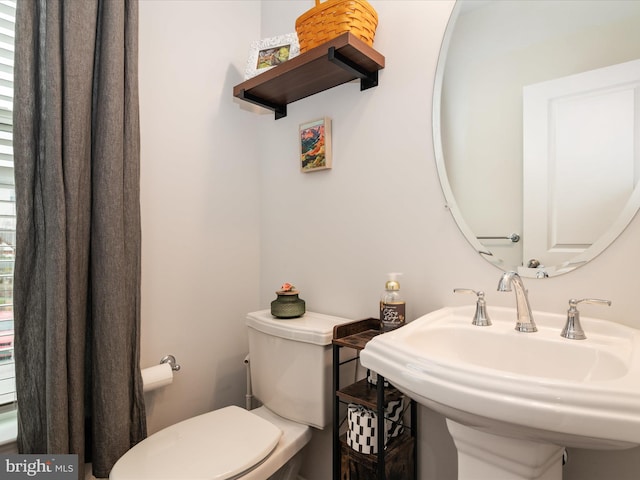 bathroom with toilet and sink