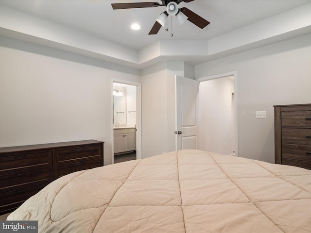 bedroom featuring ceiling fan and ensuite bath