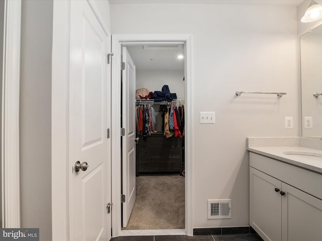 bathroom with vanity and tile patterned floors