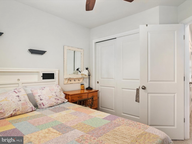 bedroom featuring ceiling fan and a closet