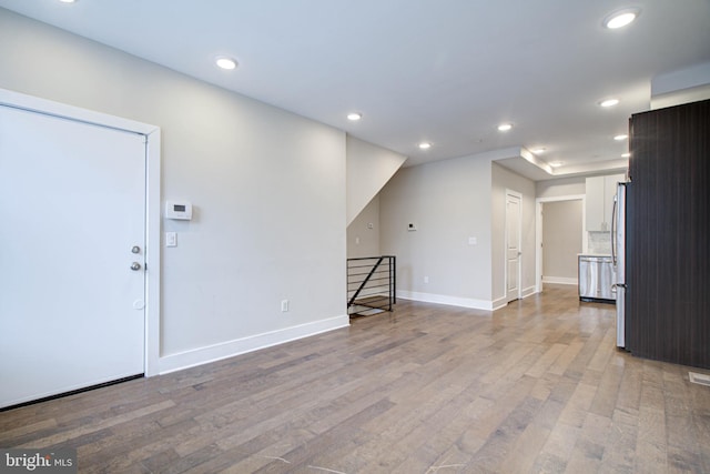 unfurnished living room featuring light wood-type flooring