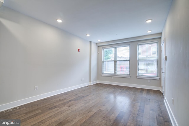 empty room featuring dark hardwood / wood-style floors