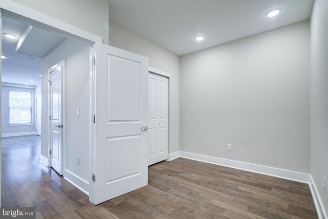 hall with dark hardwood / wood-style floors