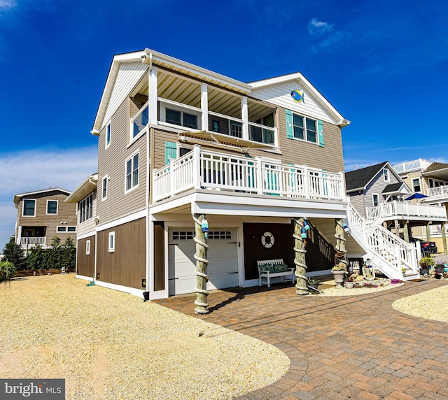 view of front of property with a porch and a garage