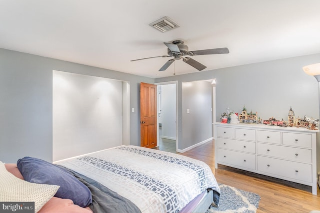 bedroom featuring light wood-type flooring and ceiling fan