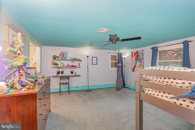 bedroom featuring ceiling fan and light carpet