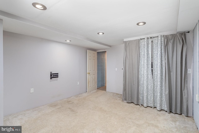 spare room with light colored carpet