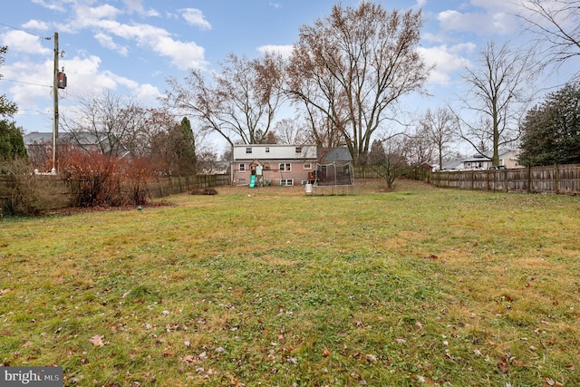 view of yard with a trampoline