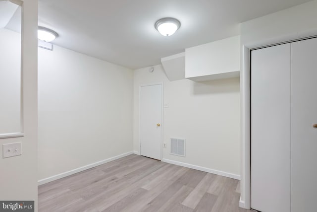 basement featuring light hardwood / wood-style floors