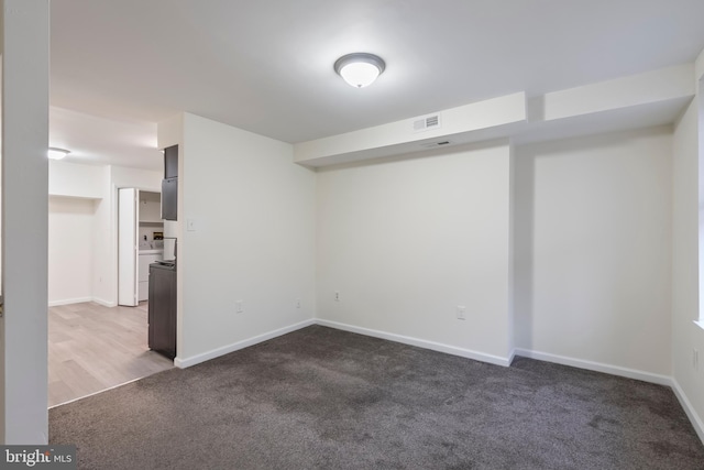 unfurnished room featuring carpet flooring