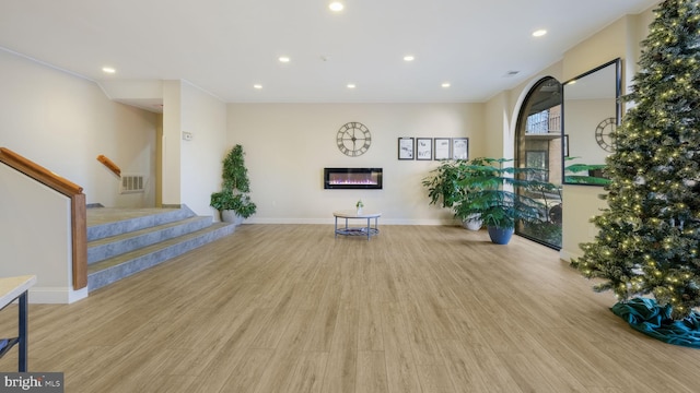 workout area featuring light hardwood / wood-style flooring