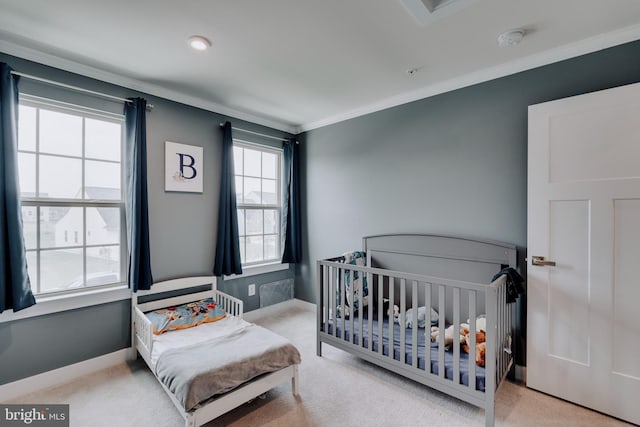 bedroom with light carpet and crown molding