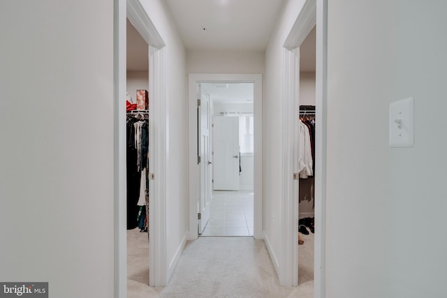 corridor with light colored carpet