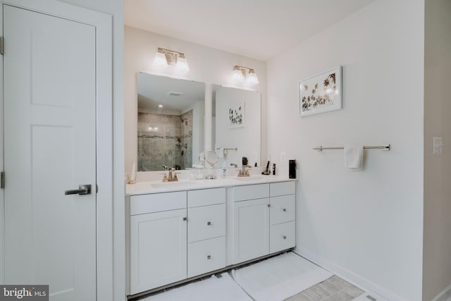 bathroom featuring vanity and an enclosed shower