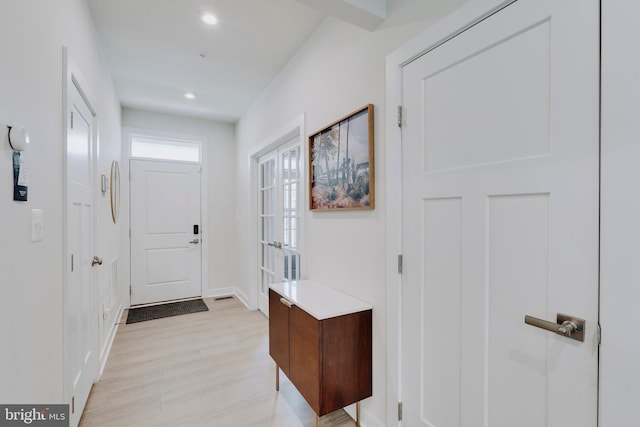 doorway to outside featuring light wood-type flooring