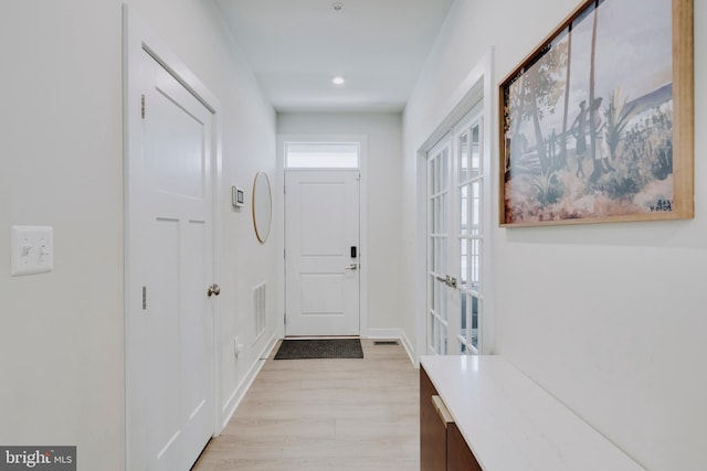 doorway to outside featuring light hardwood / wood-style flooring