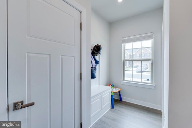 mudroom with light hardwood / wood-style floors