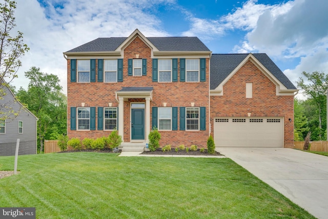 view of front of house with a garage and a front lawn