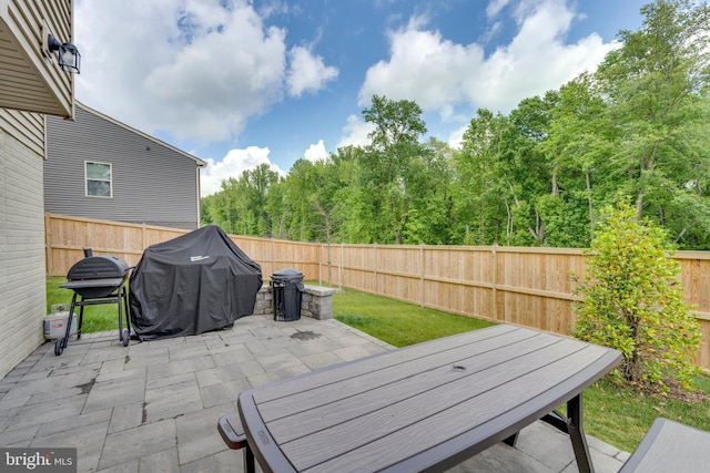 view of patio featuring a grill